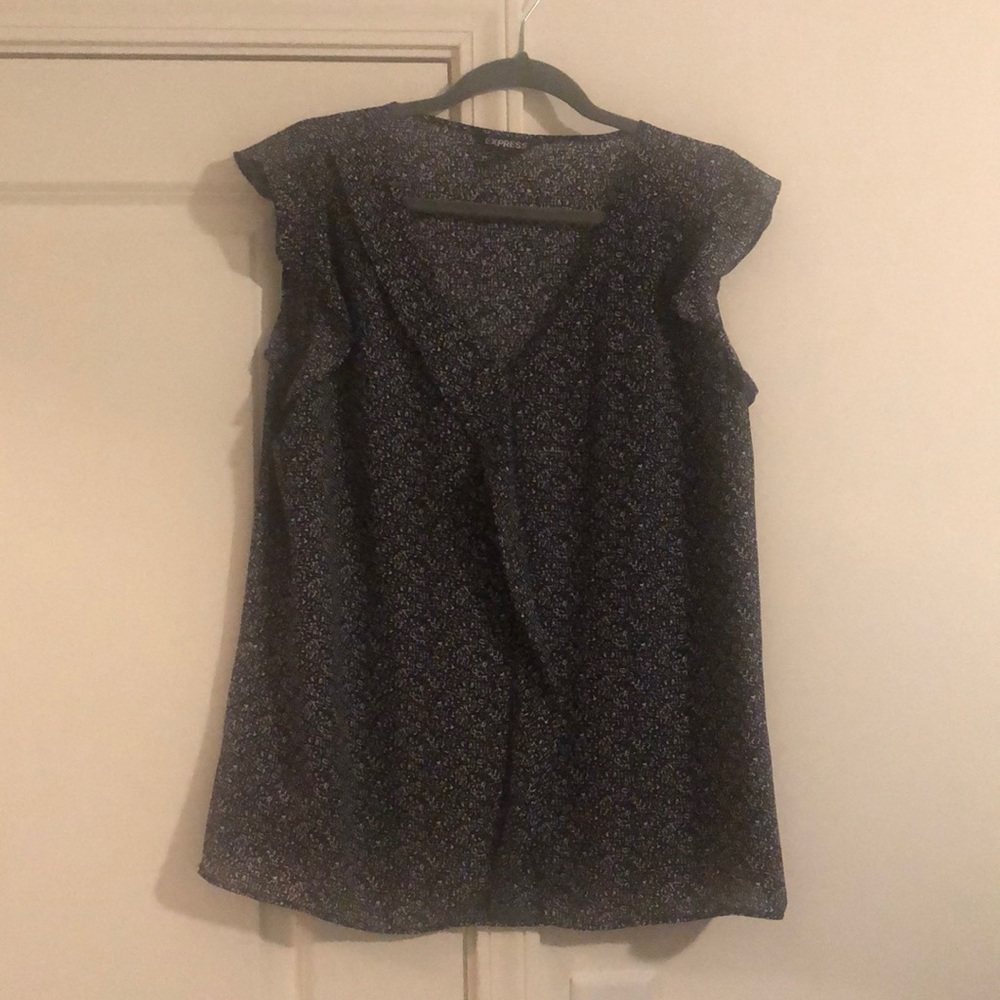 Black and white sleeveless blouse